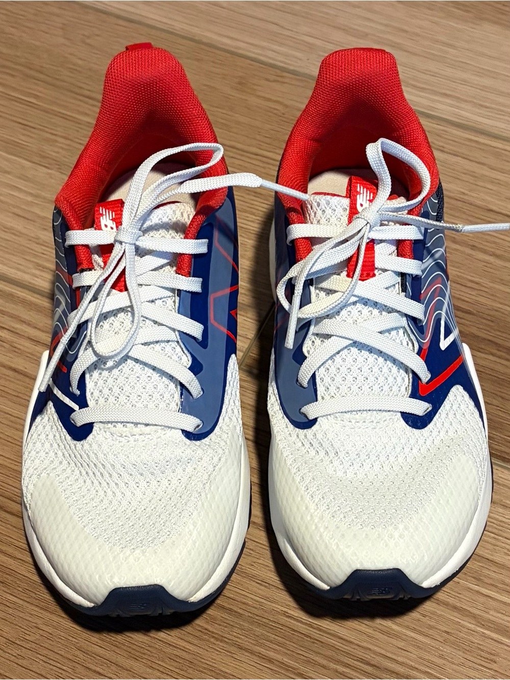 Like New, New Balance Rave Run Kids Sneakers - size 2 White / Blue / Red